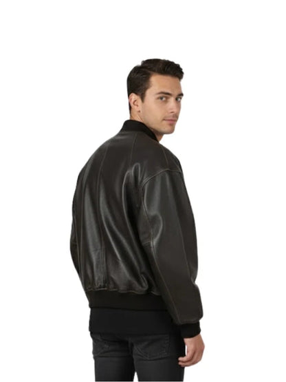 Man wearing a black leather bomber jacket on a white background