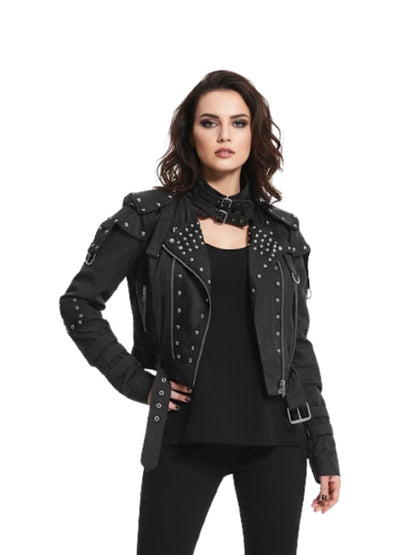 Woman wearing a black studded jacket on a white background