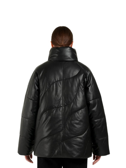 Person wearing a black leather coat on a white background