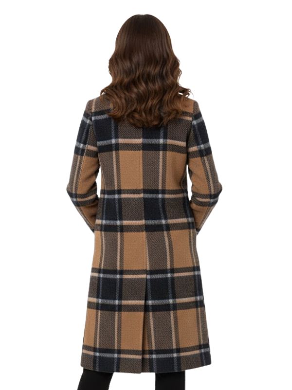 Woman wearing a plaid coat on a white background