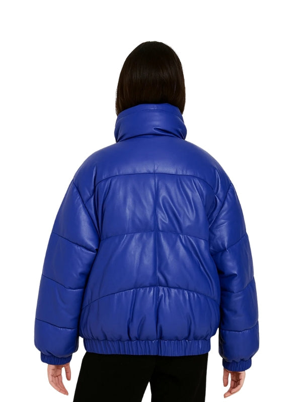 Blue puffer jacket worn by a person on a white background