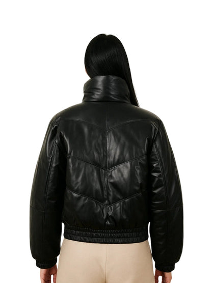 Black leather jacket worn by a person on a white background